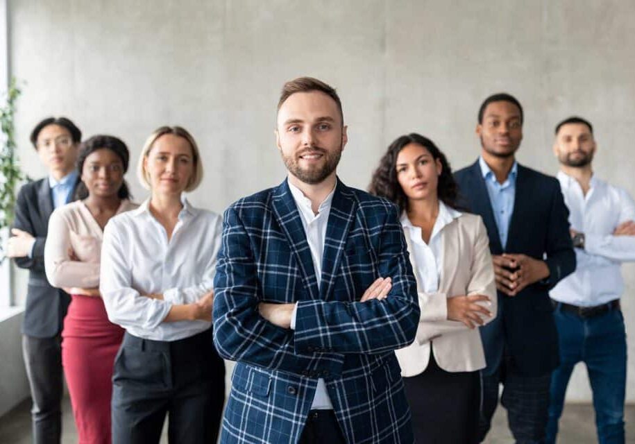businessman-standing-in-front-of-his-business-team-2023-11-27-05-01-46-utc